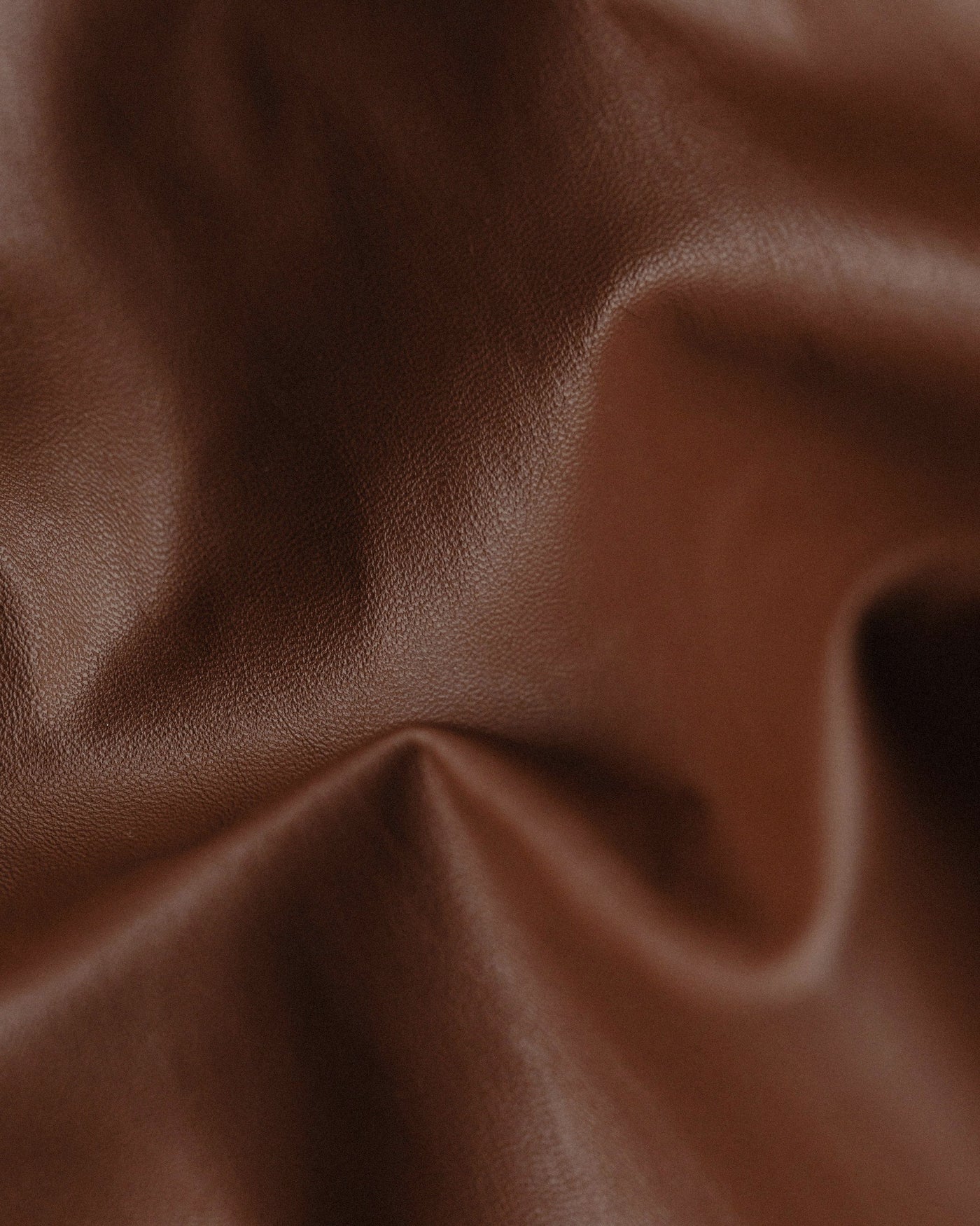 soft folds of brown leather, close up